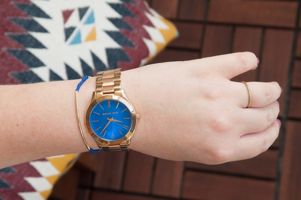 3 Easy DIY Bracelets You'll Actually Want to Wear. Image Description: A hand modeling a bracelet and watch.