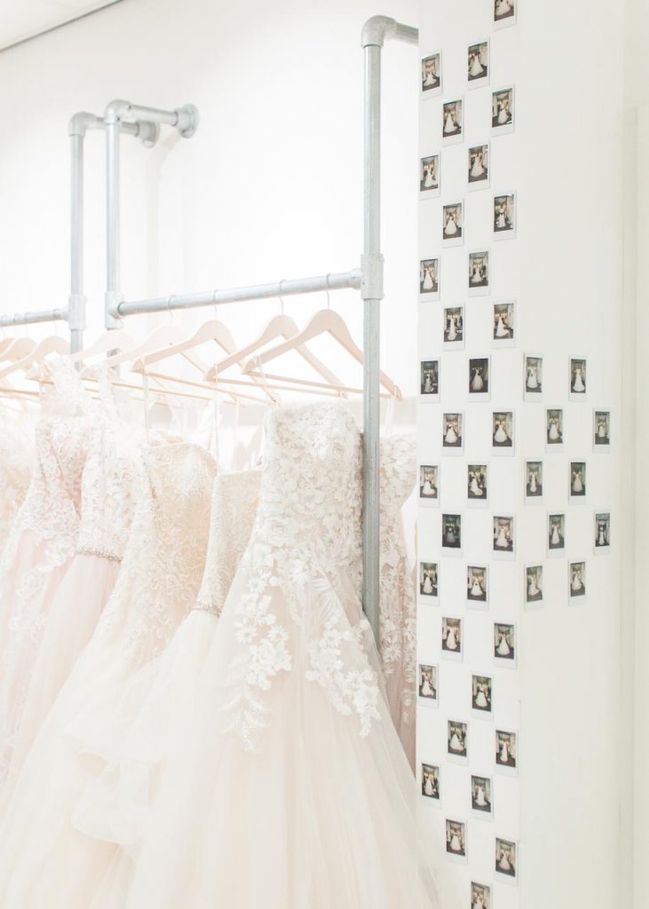 A picture of wedding dresses in the Lovely Weddings shop. Lovely Weddings — Sara Laughed