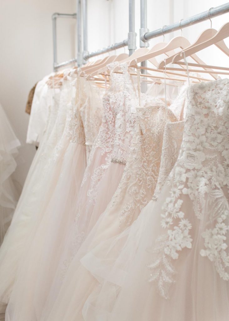 A picture of wedding dresses in the Lovely Weddings shop. Lovely Weddings — Sara Laughed