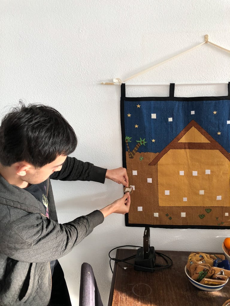 Ken dramatically pinning our first Advent calendar piece to the tree